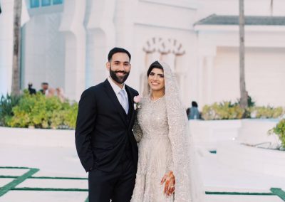 a photograph of a married couple with a stunning background of our mosque and wedding venue in Florida, USA